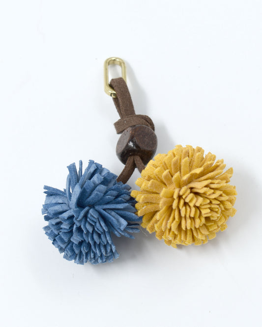 Pompom Charm Blauw Oker