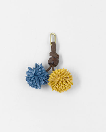 Pompom Charm Blauw Oker